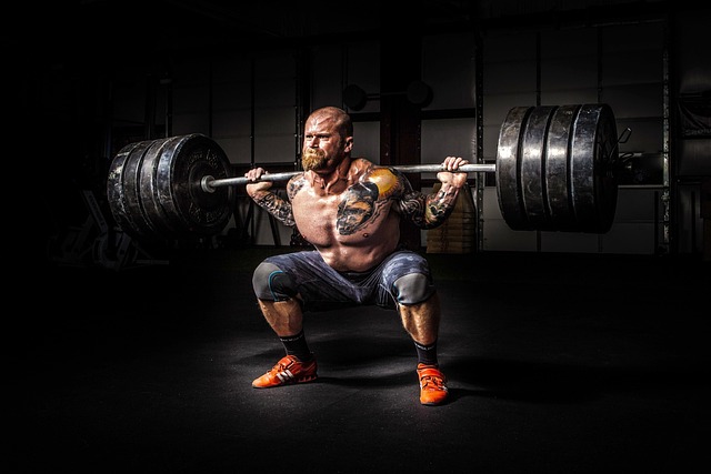 Weightlifter executing a powerful clean and jerk.